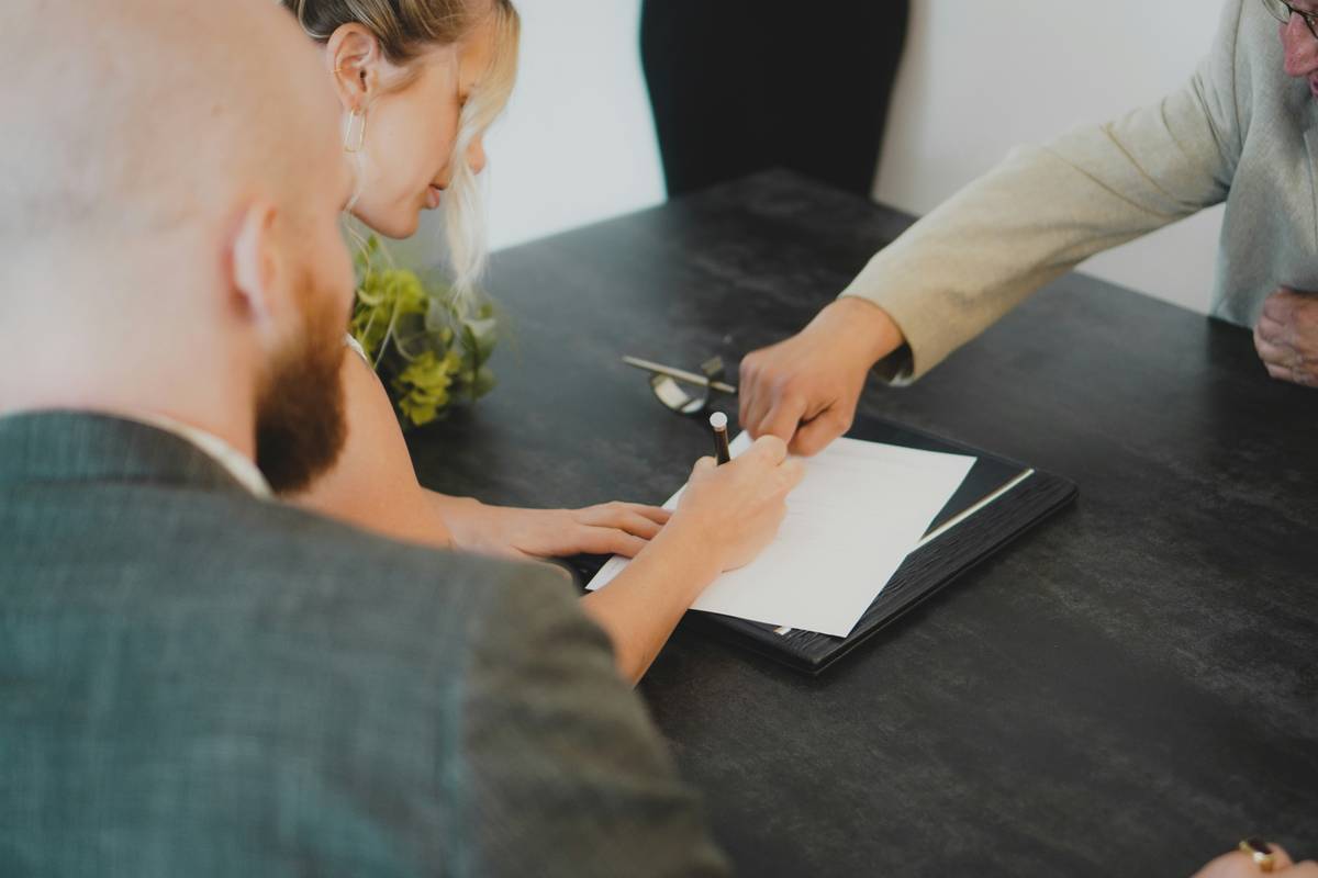 Host reviewing short term rental agreement on tablet at property