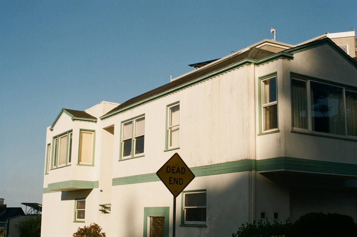 what is passive rental income illustrated with a landlord reviewing rental statements while relaxing